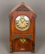 A Continental Arts & Crafts oak cased wall clock by Gustav Becker,