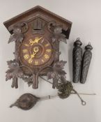 A vintage Black Forest oak cuckoo clock