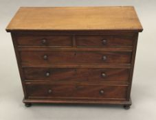 A Victorian mahogany miniature chest of drawers.