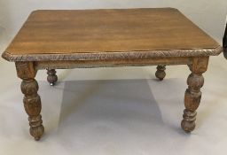 A 19th century carved oak dining table, with fixed top. 137 x 105 cm, 73 cm high.