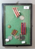 A display case containing various militaria,