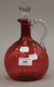 A cranberry and clear glass ewer