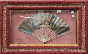 A cased 19th century French painted fan with carved ivory guards