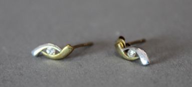 A pair of 9 ct bi colour gold diamond earrings (0.