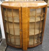 A mid 20th-century walnut display cabinet