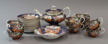 A 19th century Mason's Ironstone tea service, comprising tea pot, twelve cups and saucers,