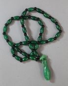 A spinach jade necklace and pendant