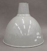 A vintage oversized enamelled industrial factory lamp shade