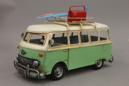 A tin plate model of a camper van