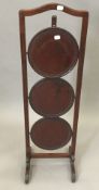 An Edwardian mahogany cake stand