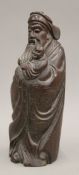 A Chinese hardwood model of a deity holding a child