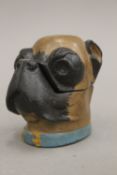 A cold painted bronze inkwell formed as a pug dog mask