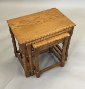 An oak nest of three tables