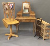 A printer's block tray, a cake stand, a director's chair, pine shelves,