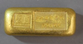 A gold coloured ingot