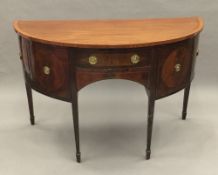 A 19th century satinwood banded and inlaid mahogany demi-lune sideboard/serving table,
