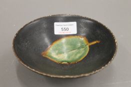 A Chinese pottery conical bowl, with leaf decoration. 15.