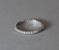 A 9 ct white gold eternity ring (1.