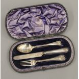 A cased silver knife, fork and spoon set (3.