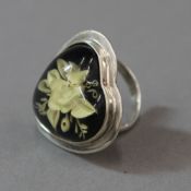 A silver heart flower ring