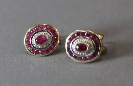 A pair of 9 ct gold ruby and diamond earrings