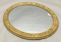 A 19th century gilt framed oval mirror