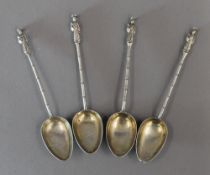 Four Chinese white metal, possibly silver spoons,