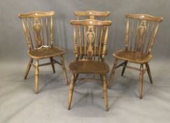 A set of four solid seated kitchen chairs