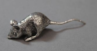 A small silver model of a mouse