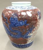 A large Chinese porcelain vase decorated with a dragon