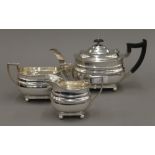 A silver three piece tea set (37 troy ounces total weight)