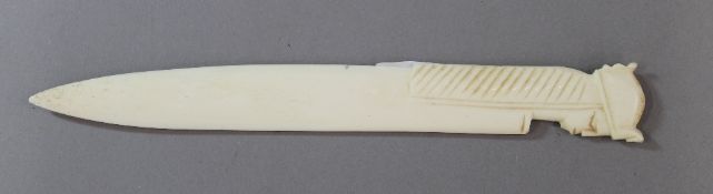 A bone paperknife with Egyptian mask handle