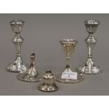 Two pairs of silver candlesticks (20.