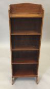 A small Edwardian inlaid mahogany bookcase