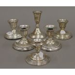 Two pairs of loaded American sterling silver dwarf candlesticks,