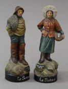 A pair of French terracotta souvenir figurines