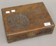 A small Chinese carved wooden box