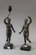 A pair of bronze cast female figures, modelled dancing and previously mounted as lamp bases.