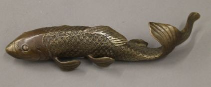 A patinated brass model of a fish