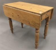 A Victorian pine drop flap Pembroke table,