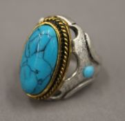 A turquoise set dress ring