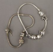 Two Pandora silver bracelets with charms (50.