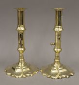 A pair of George III mid-18th century brass side ejector candlesticks. 20.5 cm high.