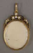 A 15 ct gold seed pearl mounted picture pendant (11 grammes total weight)