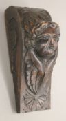 An 18th century carved oak angel corbel