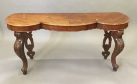 A Victorian walnut hall table with shaped top and cabriole legs. 157 x 44 cm, 73.5 cm high.