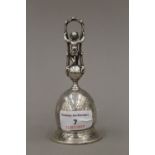 A 18th/19th century finely detailed white metal (tests as silver) desk bell,