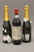 Two bottles of Sparkling Prosecco and a bottle of 1971 Pauillac Grand Vin Du Prelat