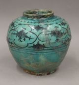 An early Persian pottery vase with turquoise glaze