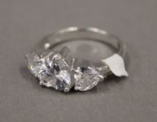 A silver and cubic zirconia heart shaped ring